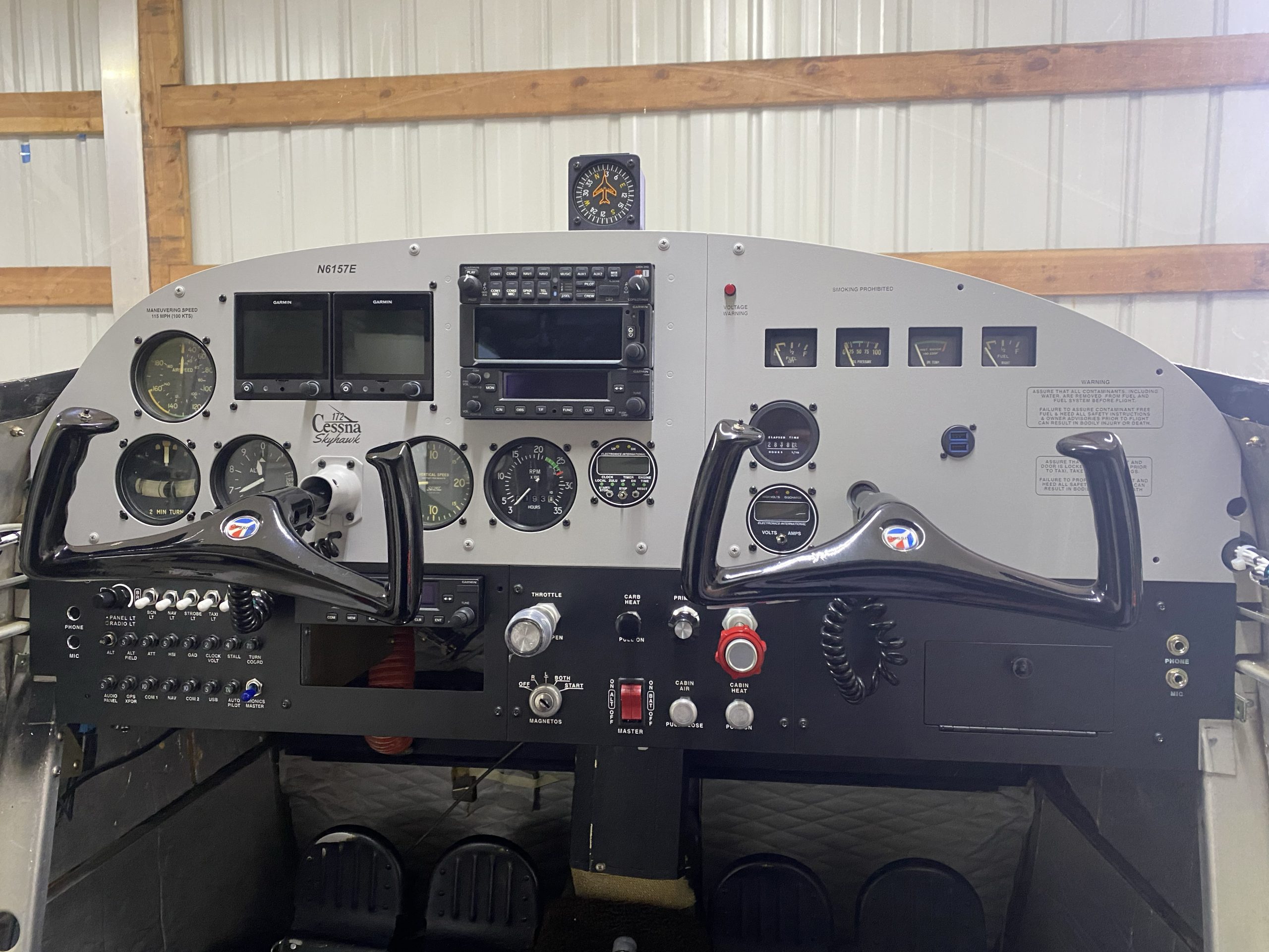 1959 Cessna 172 Instrument Panel with a radio stack and dual G5's